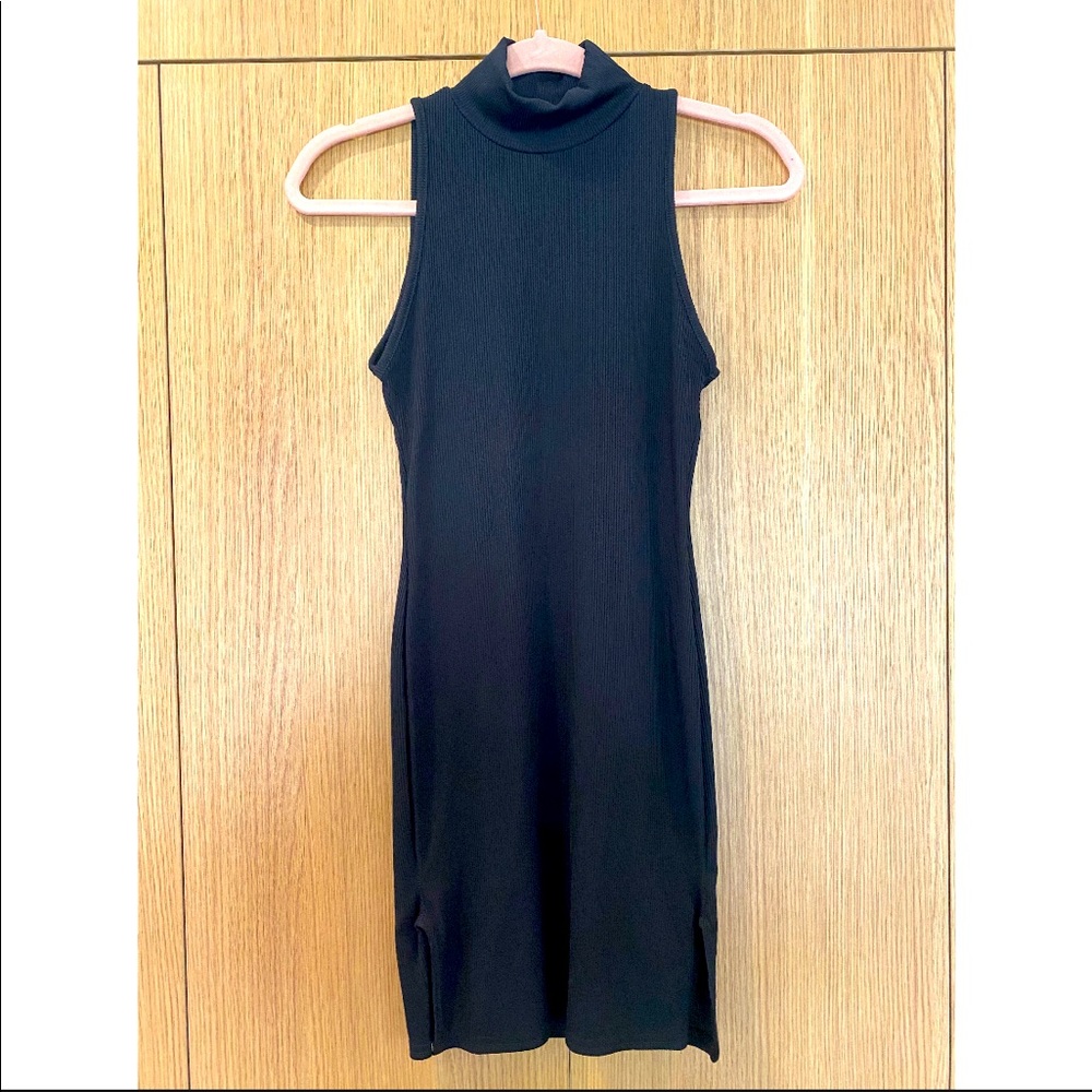 Black sleeveless turtle neck dress